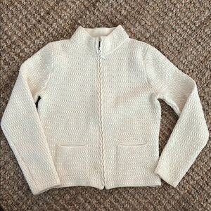 Cream zip-up cardigan sweater with stand-up collar and textured knit